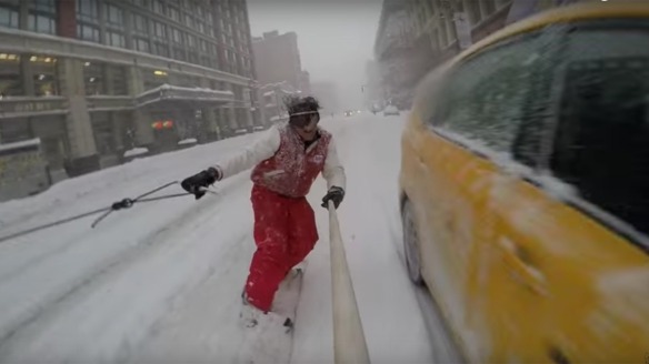 Some guy named Casey Neistat, snowboarding behind a Jeep, driven by his brother, through the streets of snow-covered Manhattan. Very cool!
